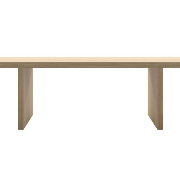 “Room setting featuring the natural oak Millenium Hope table in a minimalist dining area, its solid presence anchoring the space.”