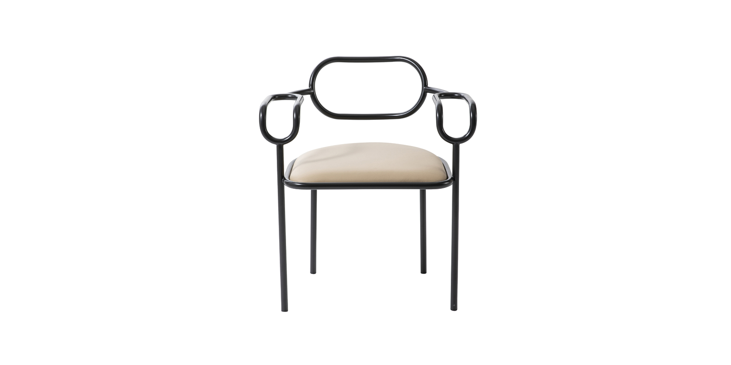 "Contemporary entryway styled with multiple 01 Chairs, their interwoven form creating a sculptural ensemble."