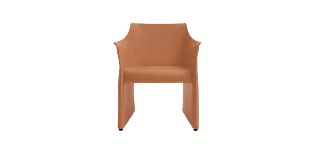 "Cap Chair 2 in a dining room setting, with its understated design complementing a minimalist table and decor."