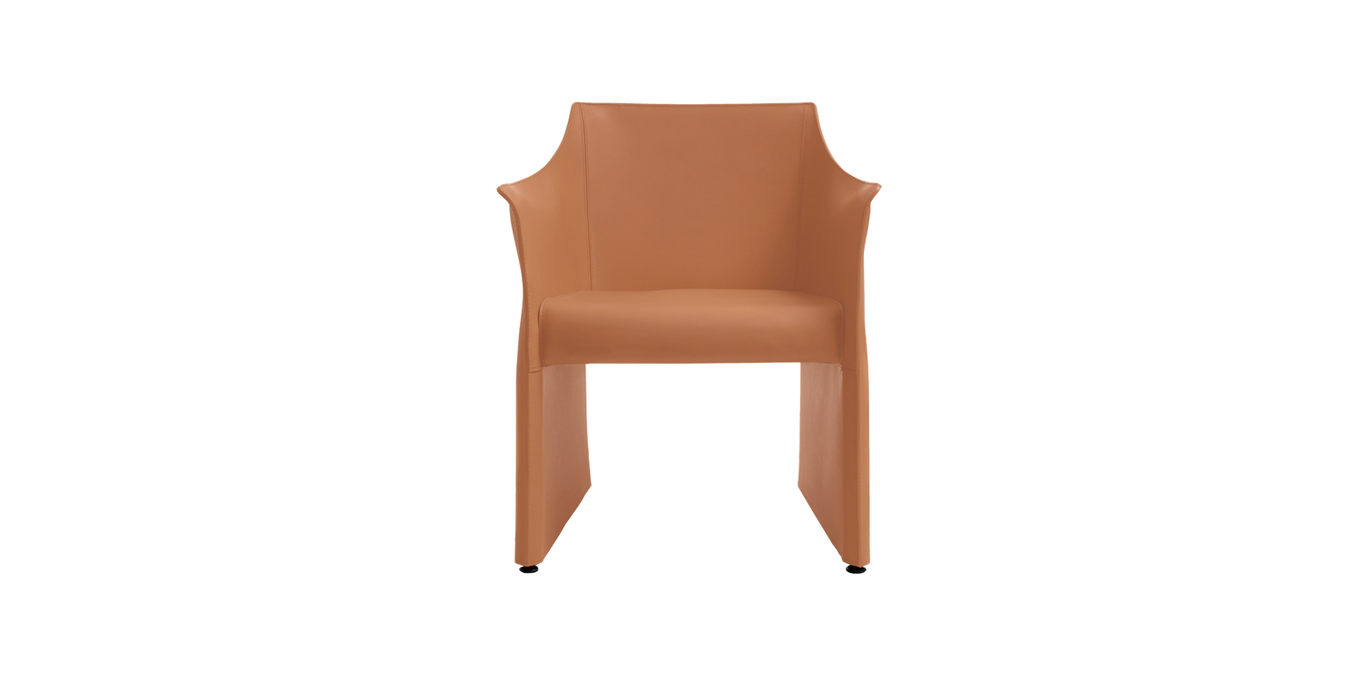 "Cap Chair 2 in a dining room setting, with its understated design complementing a minimalist table and decor."
