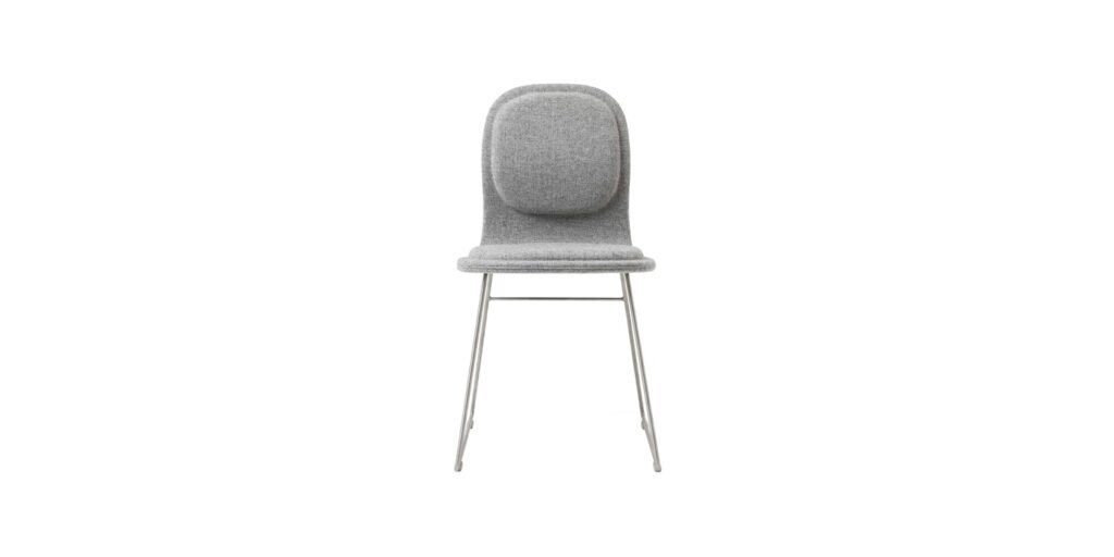 "Hi Pad stool in a cafe setting, highlighting its sleek design and durable construction."