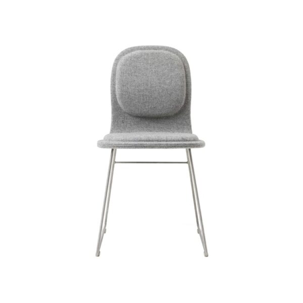 "Hi Pad stool in a cafe setting, highlighting its sleek design and durable construction."