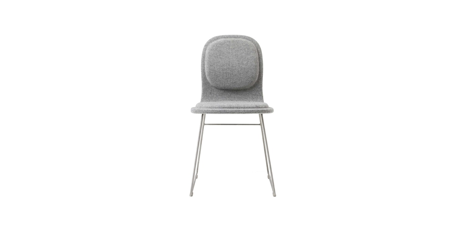 "Hi Pad stool in a cafe setting, highlighting its sleek design and durable construction."