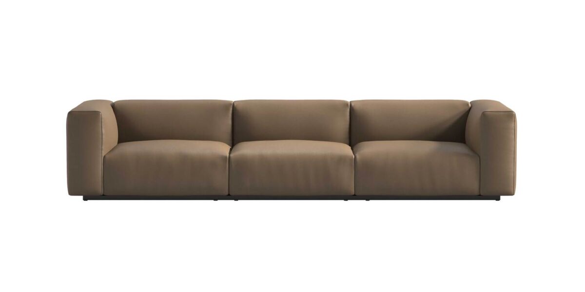 “Top view of Oblong Plus bed version, showing its padded headboard modules in navy and cream upholstery on a platform base.”