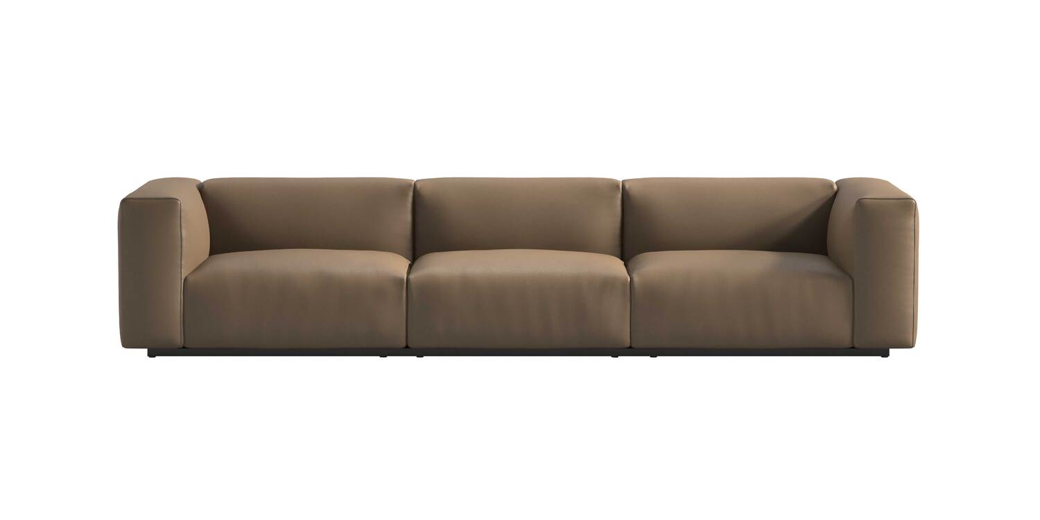 “Top view of Oblong Plus bed version, showing its padded headboard modules in navy and cream upholstery on a platform base.”