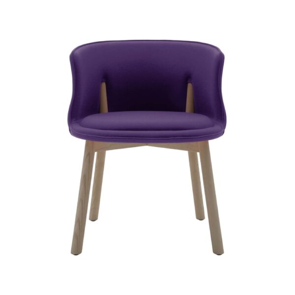 "Detail shot of the Peg Chair’s rigid foam shell and co-injected polyurethane cushion on ash legs."