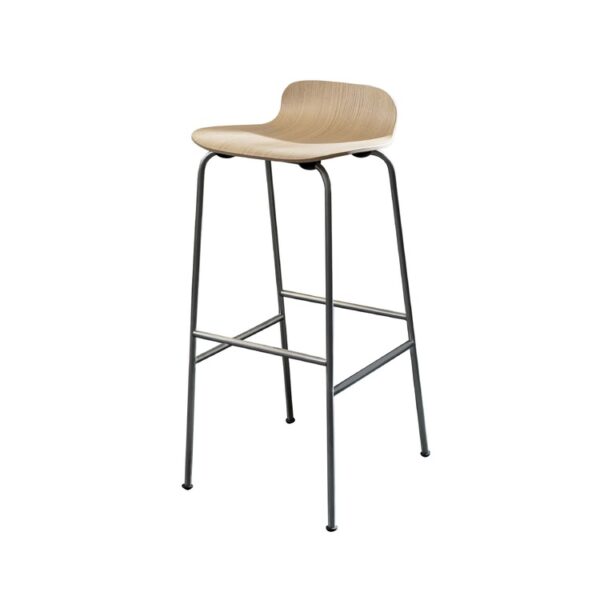 “Close-up of the curved plywood backrest and edge detailing on a Tate Wood stool with white-stained veneer and polished sled base.”