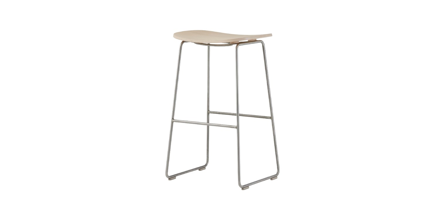 “Detail shot of footrest support brace and polypropylene foot caps beneath a high Morrison Stool.”