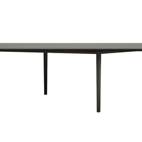 “Environmental shot of black Openup table set in a spacious room, light filtering through its open, airy structure.”