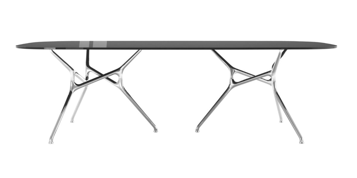 “Round Branch Table in a lounge space, its organic aluminum base reflecting soft light and extending visual movement.”