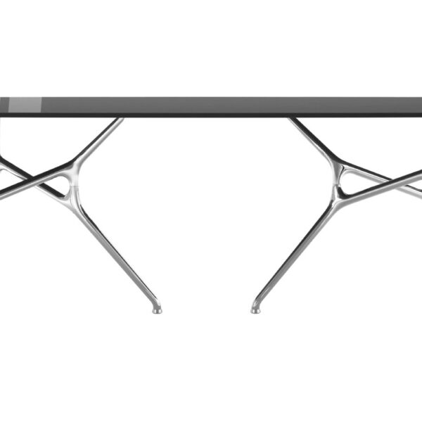 “Round Branch Table in a lounge space, its organic aluminum base reflecting soft light and extending visual movement.”