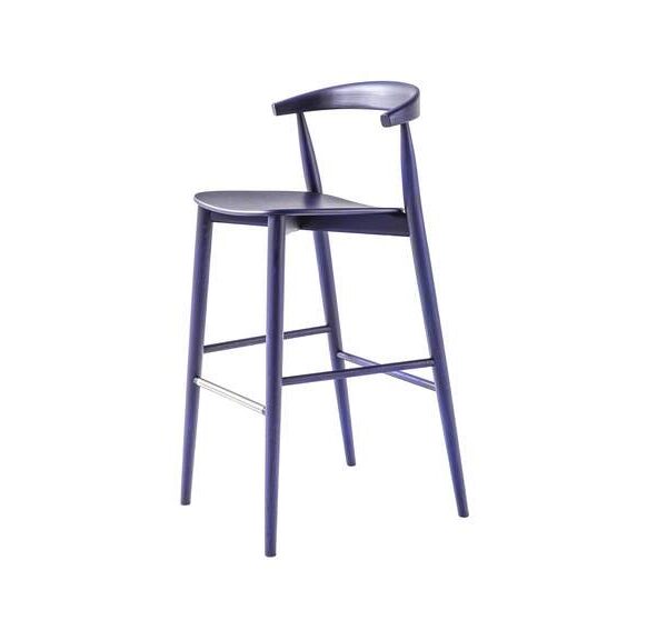 “Studio setting with Newood Light Stool in bleached ash beside a wooden table, casting soft shadows on a neutral floor.”