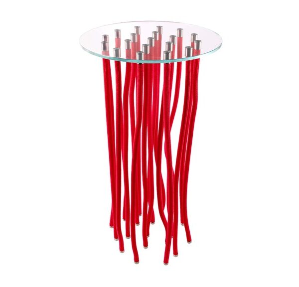 “Setting with a white-org coffee table surrounded by seating—its tendril ropes echoing organic forms in a living area.”