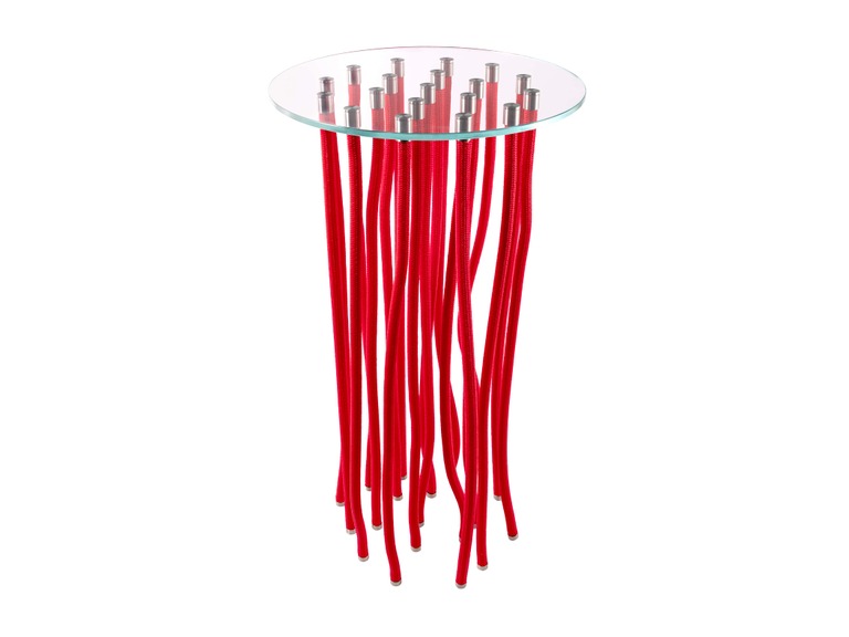 “Setting with a white-org coffee table surrounded by seating—its tendril ropes echoing organic forms in a living area.”