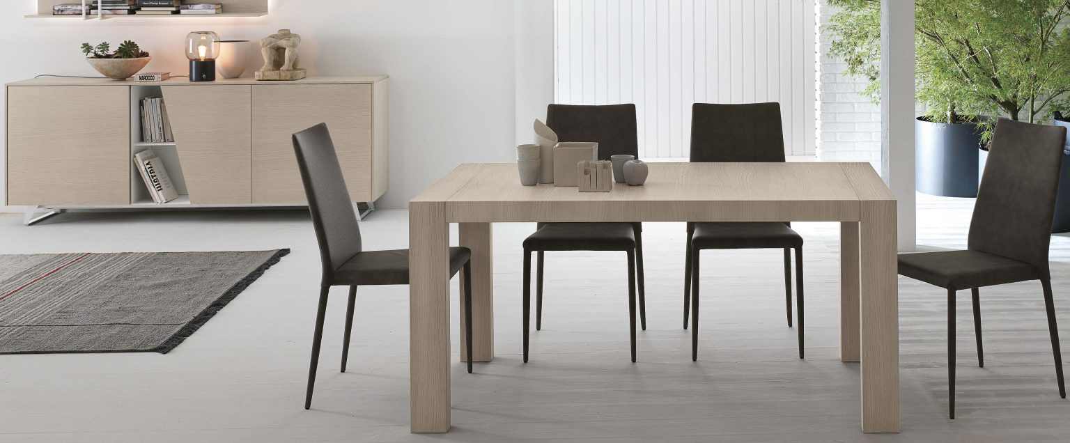 “Extendable dining table by Tomasella – Doppio Passo model with smooth expansion system and clean geometric form”