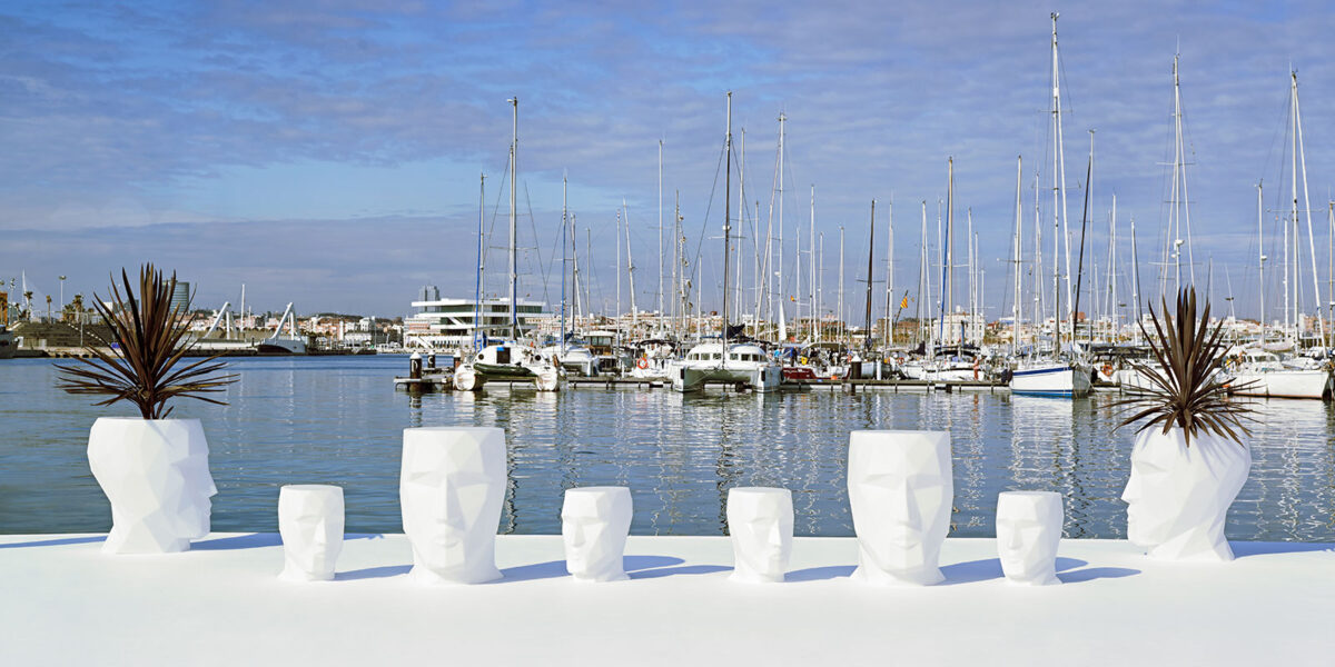 "Contemporary ADAN table by Vondom with sharp faceted sides and compact size."
