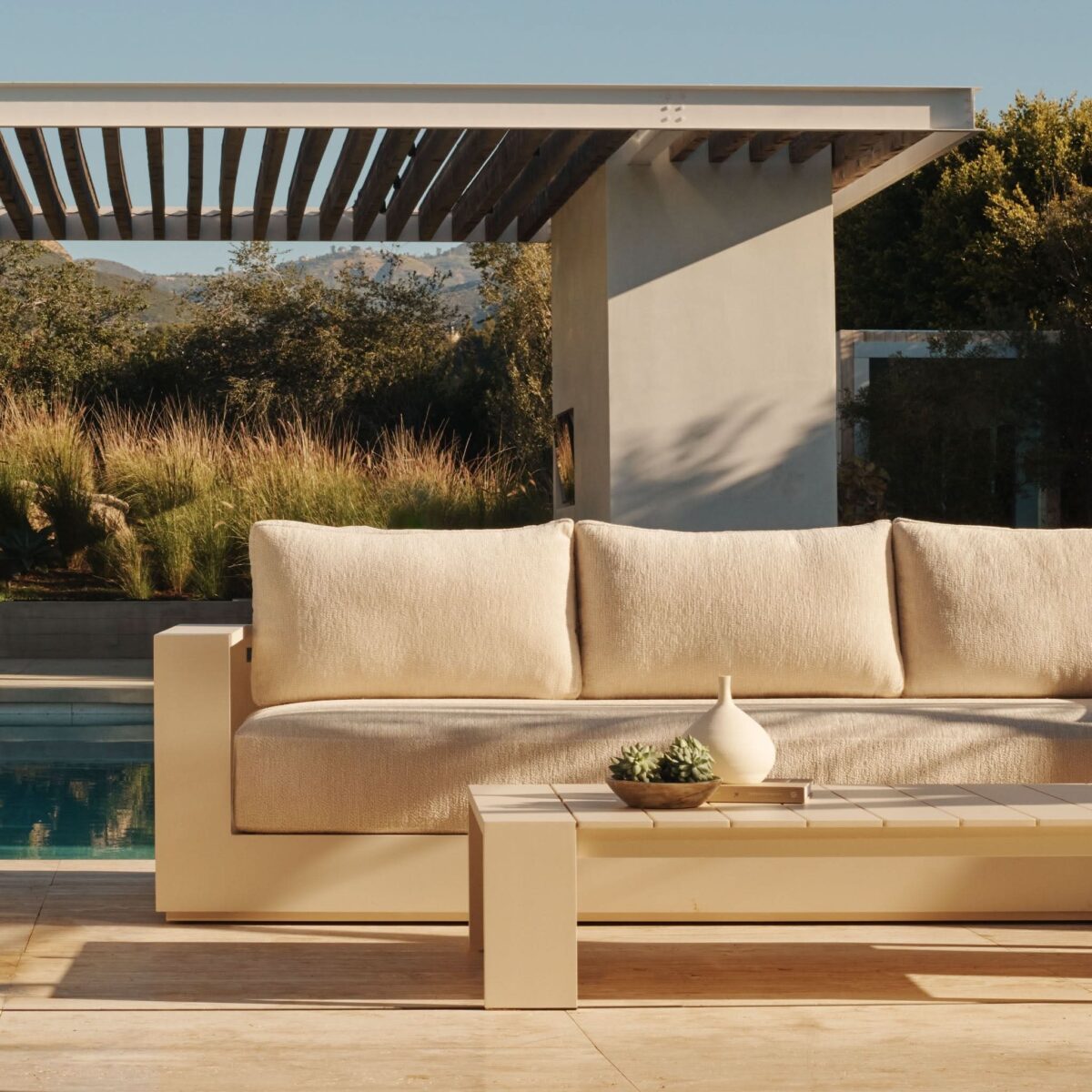 “Modern outdoor sofa – Hayman 3 Seat Sofa by Harbour in powder-coated aluminum with tailored cushions”