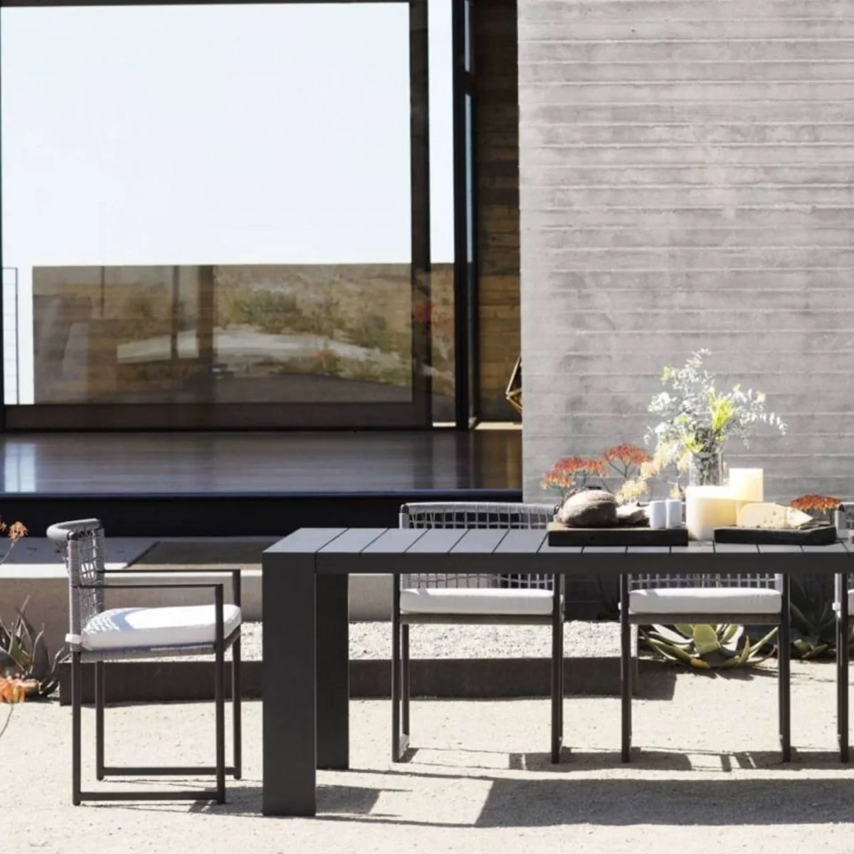 “Angled shot of Hayman 106" dining table – clean architectural lines in a neutral finish”