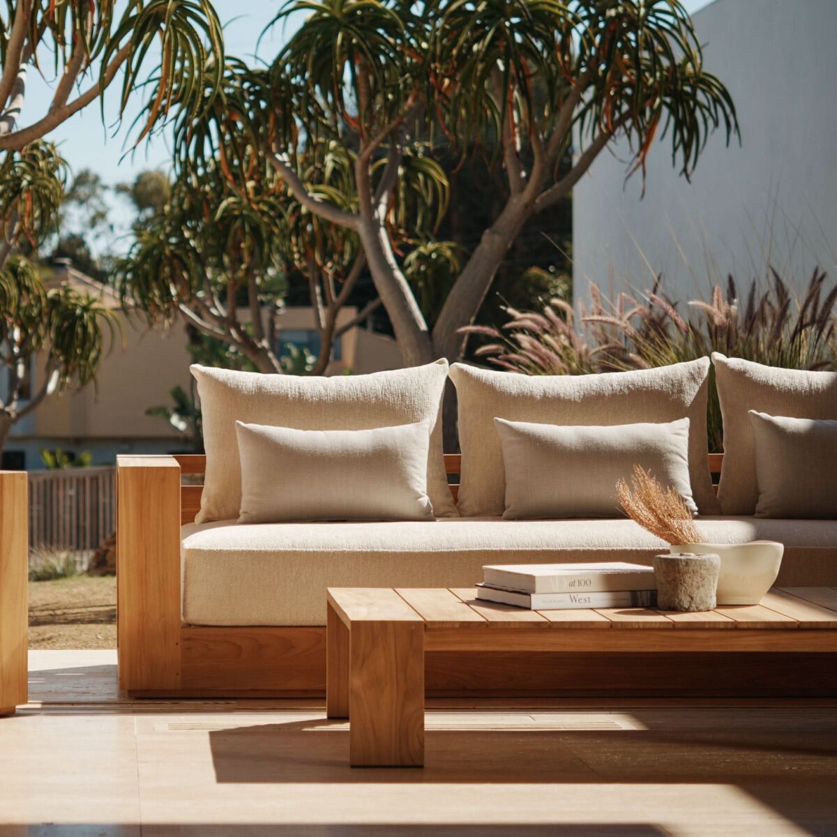 “Side profile of Hayman Coffee Table by Harbour – durable outdoor table with natural teak texture”