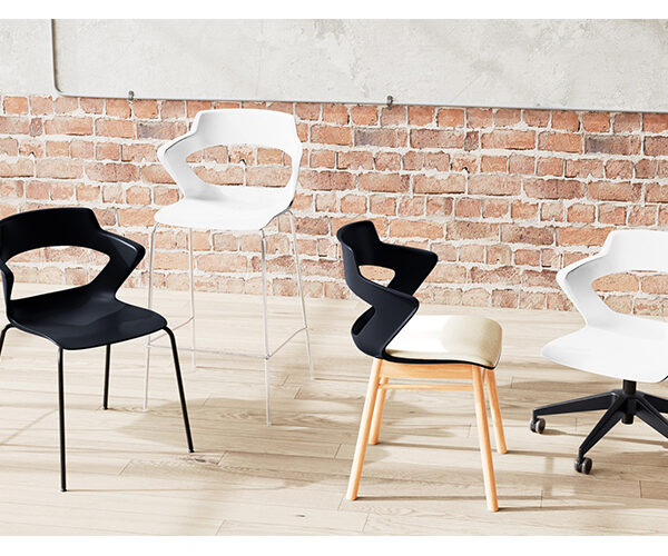 “Zee chair by Via Seating with modern curved frame at Royal Oak showroom”