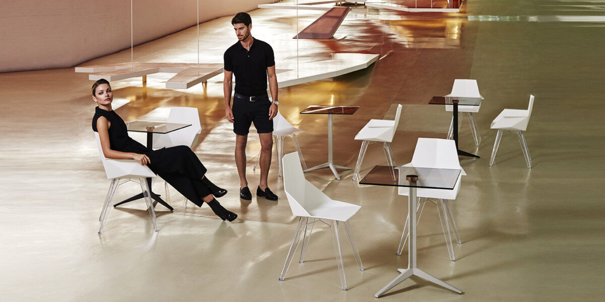 "Minimalist MAKE tables by Vondom with flat tops and slender legs for a refined look."