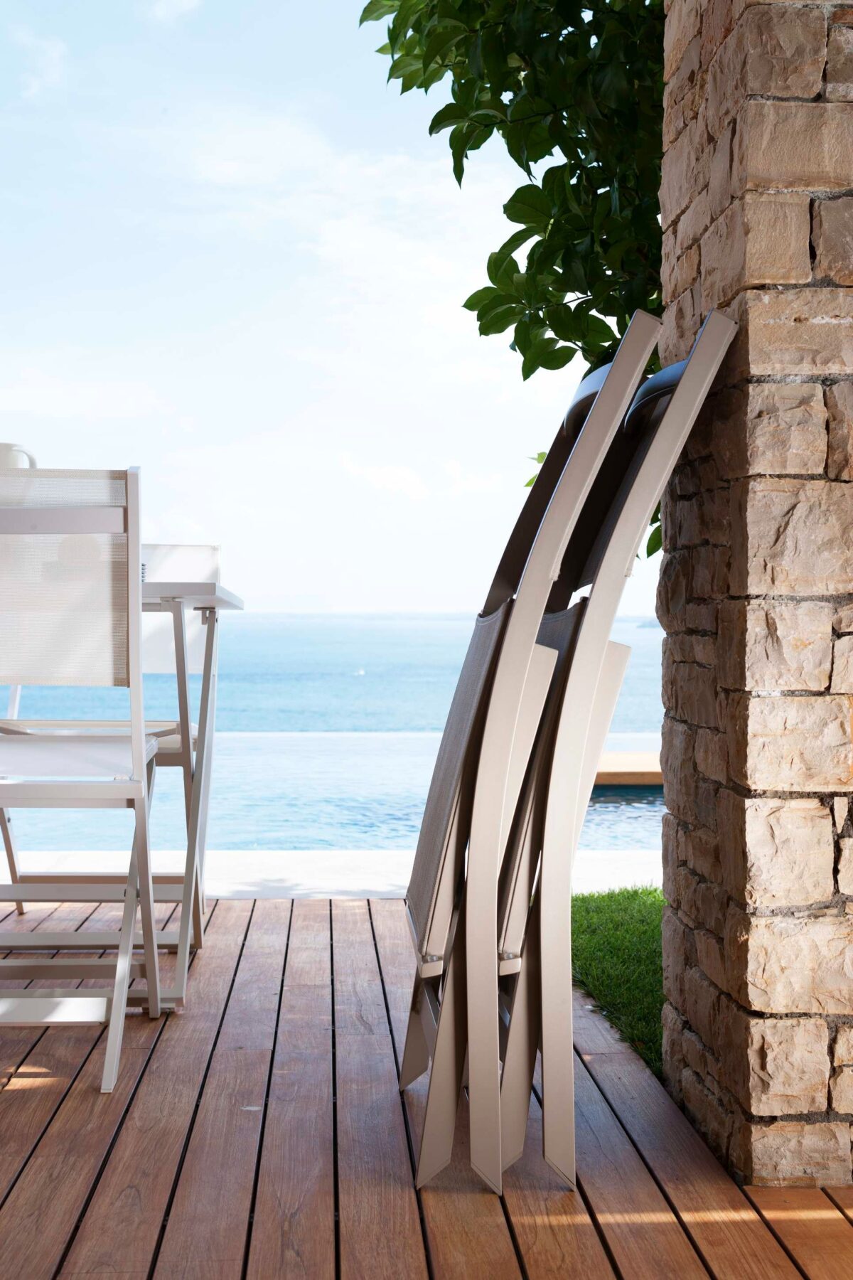 Designer Queen Folding Chair by Talenti offering versatile seating with a refined, contemporary aesthetic
