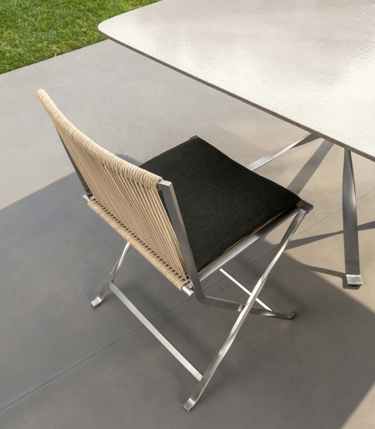 Talenti George Dining Armchair featuring aluminum frame and weather-resistant upholstery for Royal Oak, Michigan patios