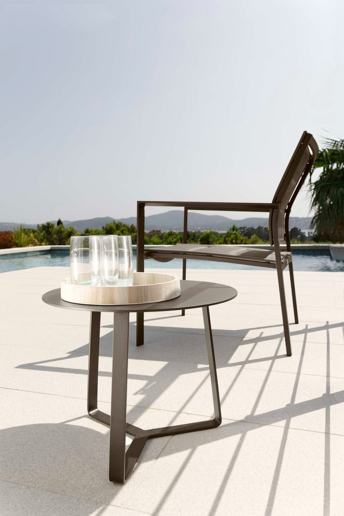 Weather-resistant Touch Pouf by Talenti in neutral tones for upscale garden lounging