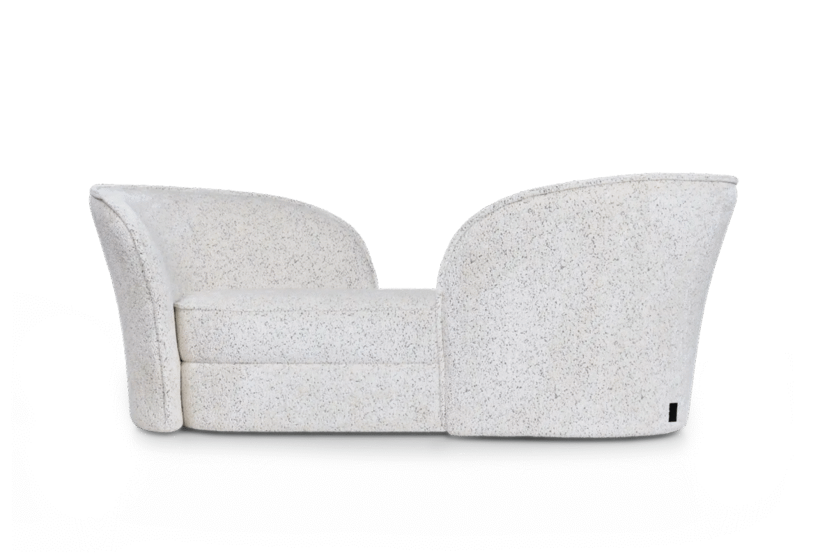 Aldora Vis a Vis sofa by Moooi with sculptural calla lily-inspired backrests, upholstered in Abbracci fabric, displayed in Royal Oak, Michigan.
