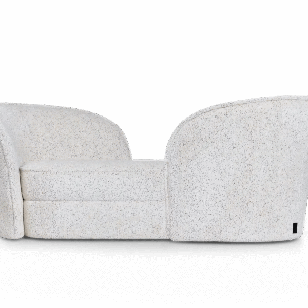 Aldora Vis a Vis sofa by Moooi with sculptural calla lily-inspired backrests, upholstered in Abbracci fabric, displayed in Royal Oak, Michigan.