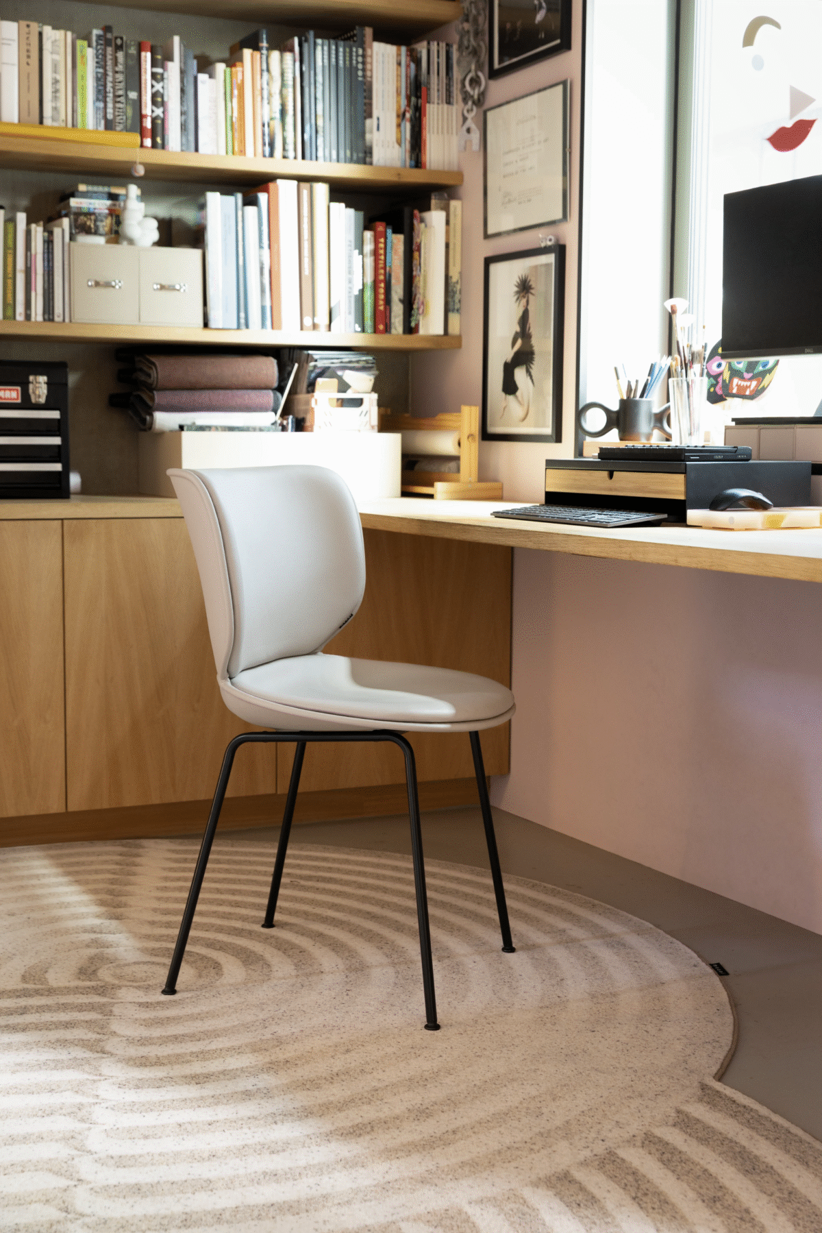 Hana Chair Upholstered by Moooi with petal-shaped backrest, upholstered seat in Liscio Grigio Blu Scuro fabric, and matte black metal legs, displayed in Royal Oak, Michigan.