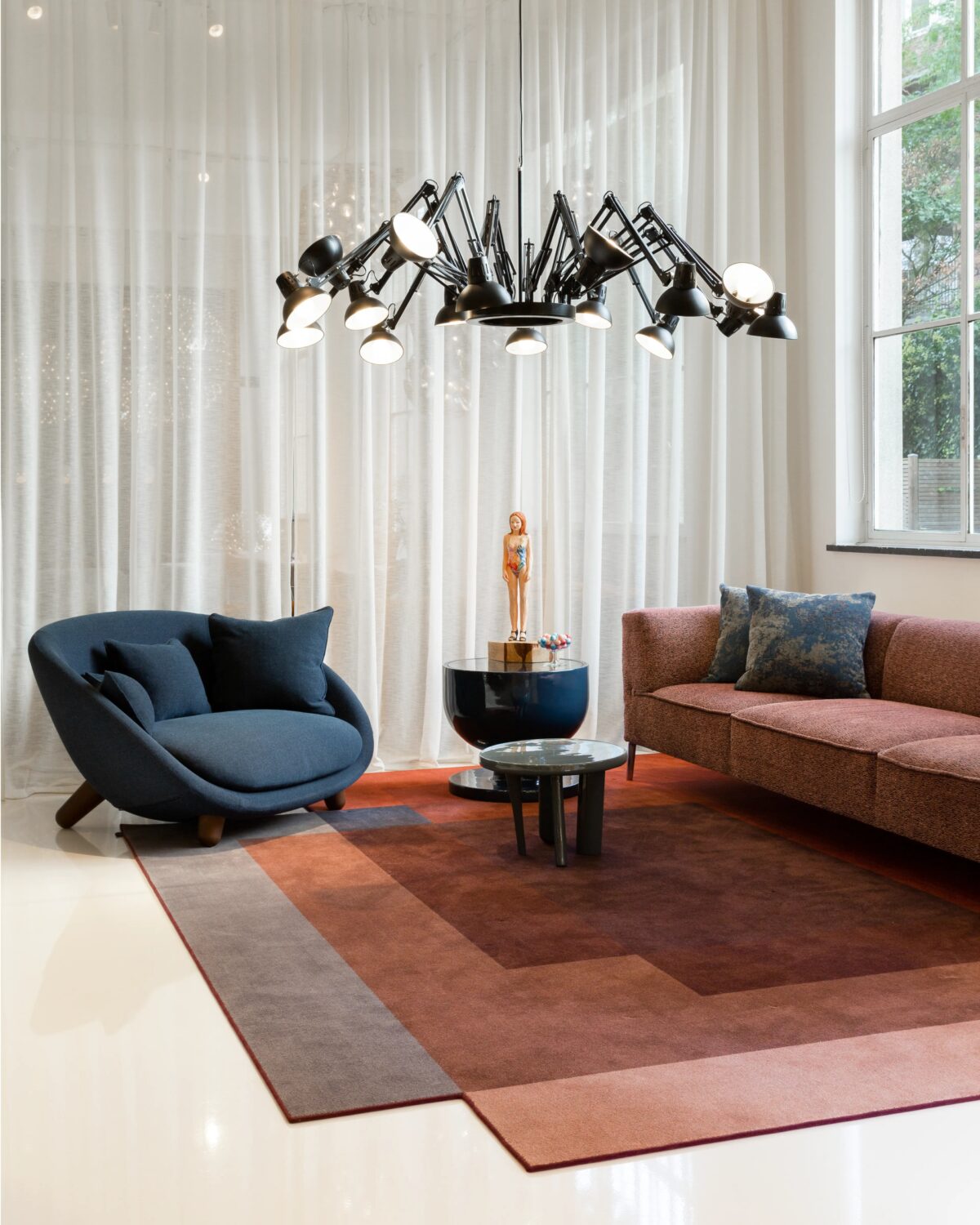 Sculptural Dear Ingo chandelier by Moooi, designed by Ron Gilad, featuring 16 adjustable lamps in a dynamic arrangement, available in Royal Oak, Michigan.
