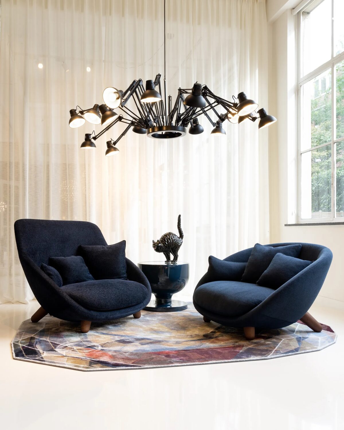 Sculptural Dear Ingo chandelier by Moooi, designed by Ron Gilad, featuring 16 adjustable lamps in a dynamic arrangement, available in Royal Oak, Michigan.