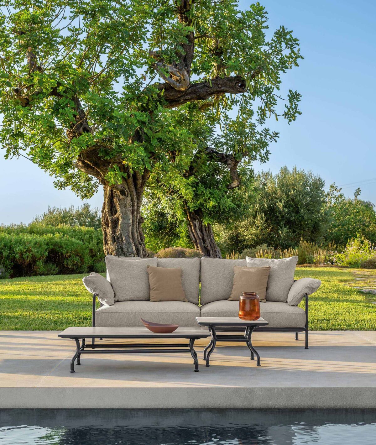 Capri Sofa 2 Seater by Talenti, combining elegance and comfort with its soft fabric upholstery and sturdy aluminum frame.