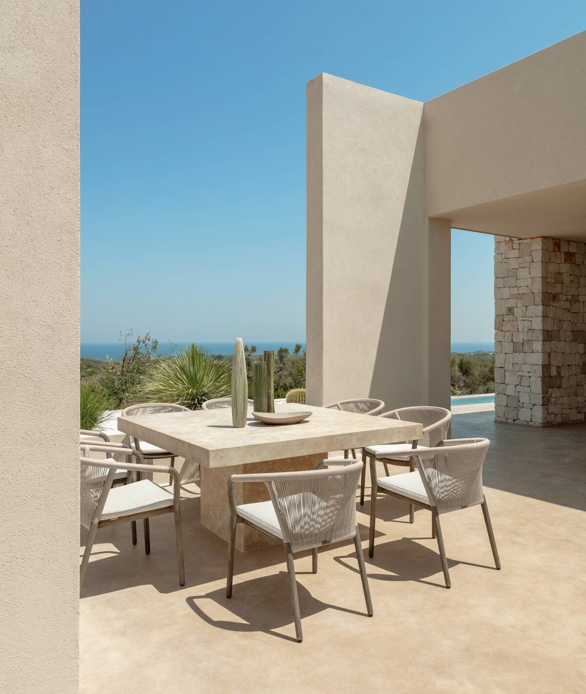Parker Sofa by Talenti, designed to enhance outdoor living spaces with its elegant teak wood structure and comfortable fabric cushions.