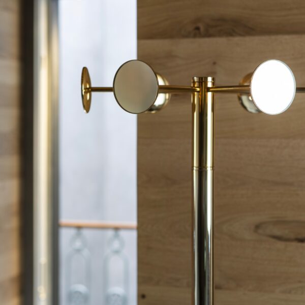 Chaperon by Opinion Ciatti in chrome finish, 18-mirror revolving coat stand, displayed in Royal Oak, Michigan.