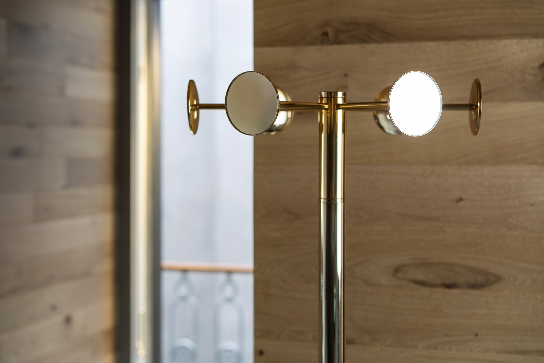 Chaperon by Opinion Ciatti in chrome finish, 18-mirror revolving coat stand, displayed in Royal Oak, Michigan.