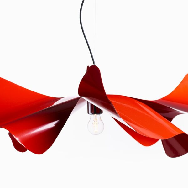 This lamp is inspired by the delicate petals of a poppy flower and is crafted from hand-folded stainless steel or brass, available in various finishes including red, white, and gold.