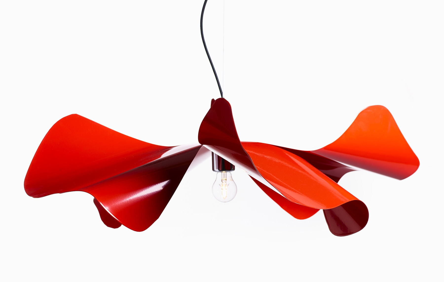 This lamp is inspired by the delicate petals of a poppy flower and is crafted from hand-folded stainless steel or brass, available in various finishes including red, white, and gold.