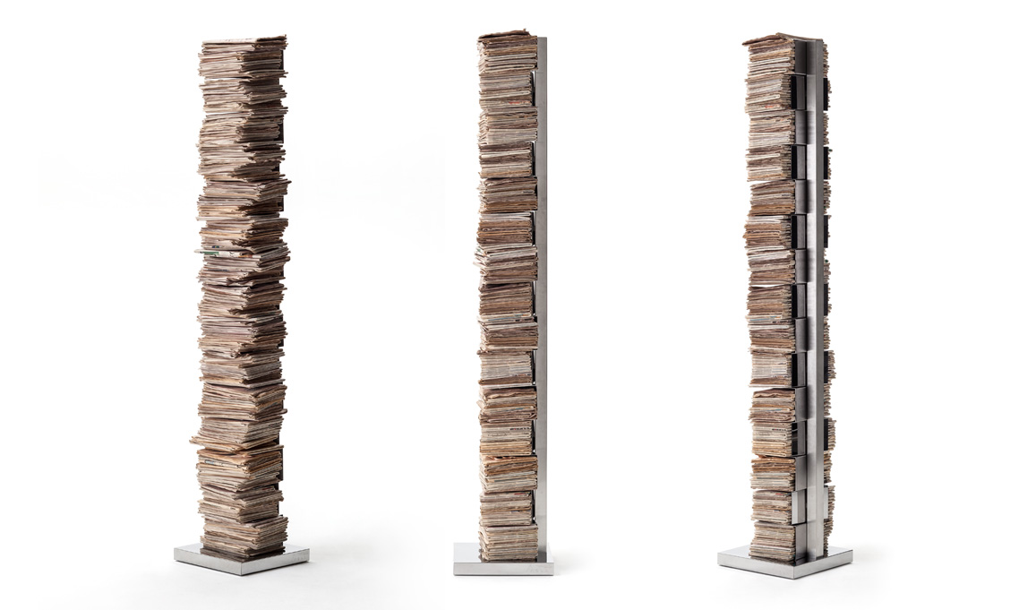 Ptolomeo Art vertical bookcase by Opinion Ciatti in matte black steel, featuring extra-large shelves for oversized books and magazines, displayed in Royal Oak, Michigan showroom.