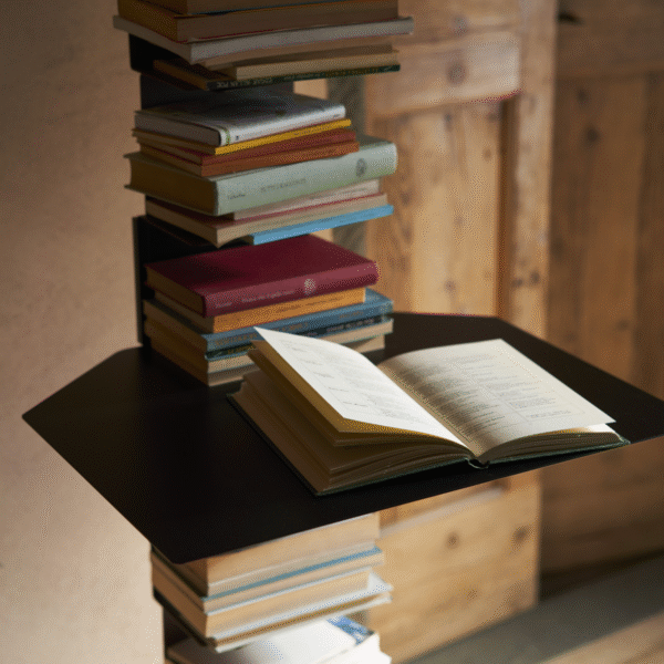 Ptolomeo Shelf by Opinion Ciatti in glossy white finish, seamlessly integrated between Ptolomeo bookcase shelves, serving as a compact writing desk or bedside table, displayed in Royal Oak, Michigan showroom.