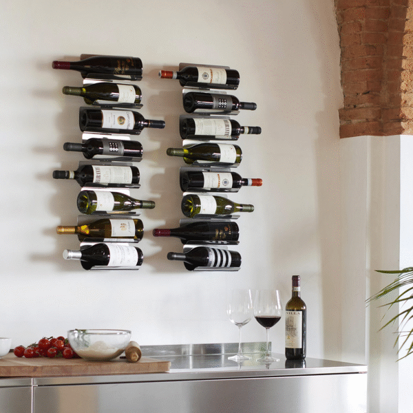 Ptolomeo Vino Wall vertical wall-mounted wine rack by Opinion Ciatti in matte black lacquered steel, featuring minimalist design with slip-resistant elastic bands to securely hold up to 22 bottles, showcased in Royal Oak, Michigan showroom.