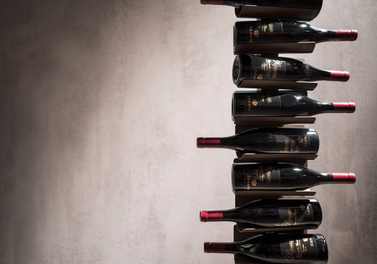 Ptolomeo Vino vertical wine rack by Opinion Ciatti in matte black steel, featuring a minimalist design that makes wine bottles appear to float, displayed in Royal Oak, Michigan showroom.