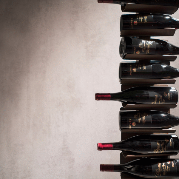 Ptolomeo Vino vertical wine rack by Opinion Ciatti in matte black steel, featuring a minimalist design that makes wine bottles appear to float, displayed in Royal Oak, Michigan showroom.