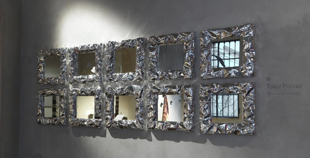 Enhance your Birmingham, Michigan space with the Tab.u Mirror by Opinion Ciatti, featuring a frame inspired by the crumpled texture of aluminum foil, adding a modern touch to your decor.
