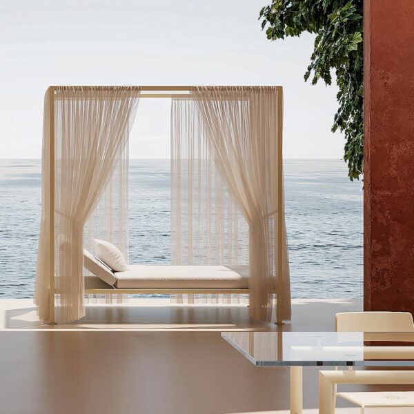 ILletto Outdoor canopy garden bed by Opinion Ciatti in beige Corkcrete finish with sheer white curtains, displayed in Royal Oak, Michigan.
