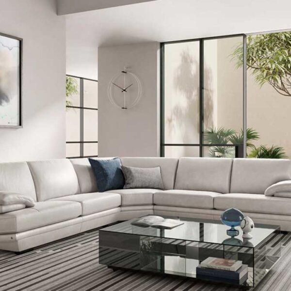 Modern Italian sectional sofa Plaza 2030 by Natuzzi Italia, featuring pillow arms, cushioned seats, high back, and optional headrest for support, available in Royal Oak, Michigan.
