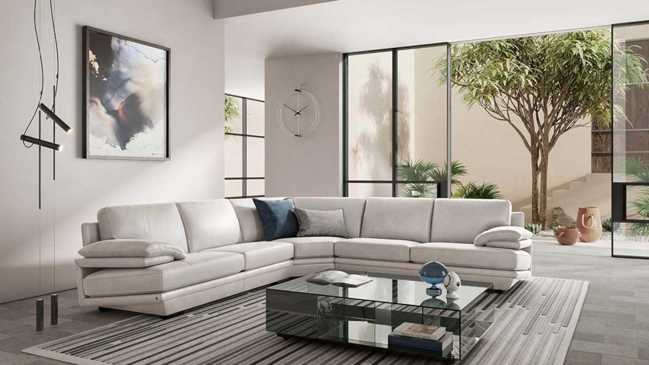 Modern Italian sectional sofa Plaza 2030 by Natuzzi Italia, featuring pillow arms, cushioned seats, high back, and optional headrest for support, available in Royal Oak, Michigan.