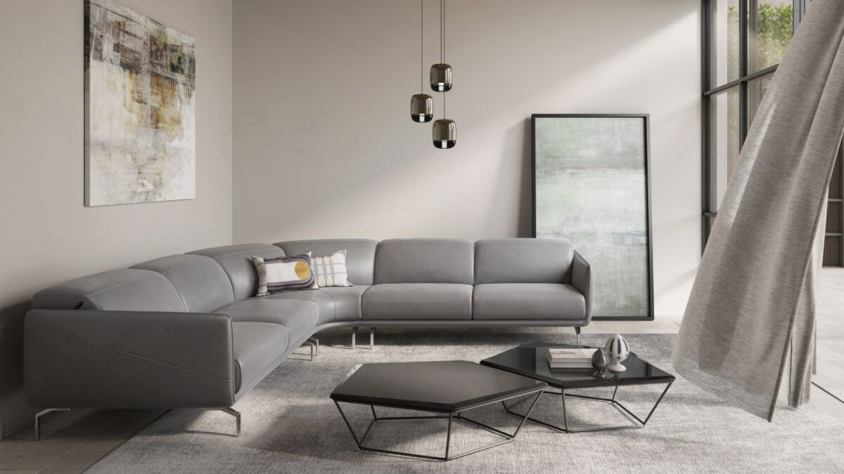 Valzer modular sofa by Natuzzi Italia with leather upholstery, adjustable headrests, and metal feet in glossy chrome finish, displayed in Royal Oak, Michigan.