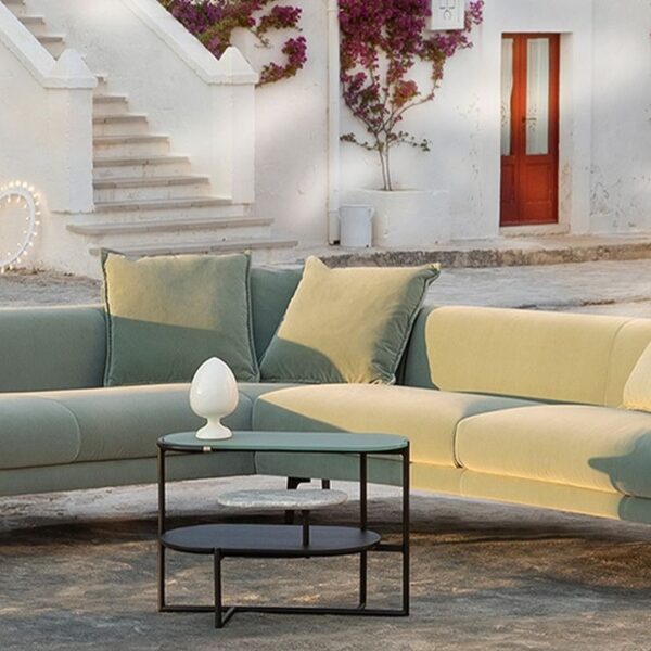 Oblò modular sofa by Natuzzi Italia, designed by Maurizio Manzoni, featuring a sleek metal frame and plush cushions, showcased in Royal Oak, Michigan showroom.